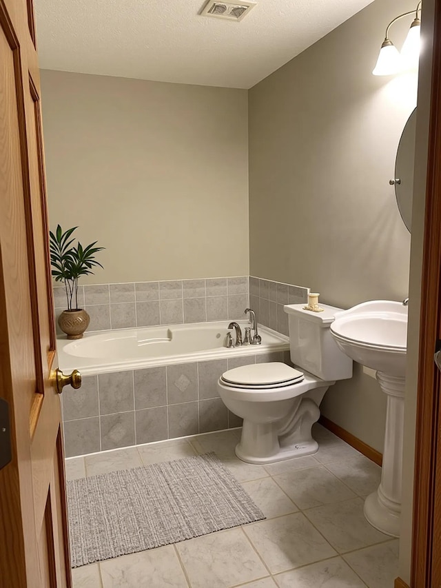 2607 226th Ln NW, Oak Grove, MN 55005 - bathroom with a garden tub, tile patterned flooring, and toilet