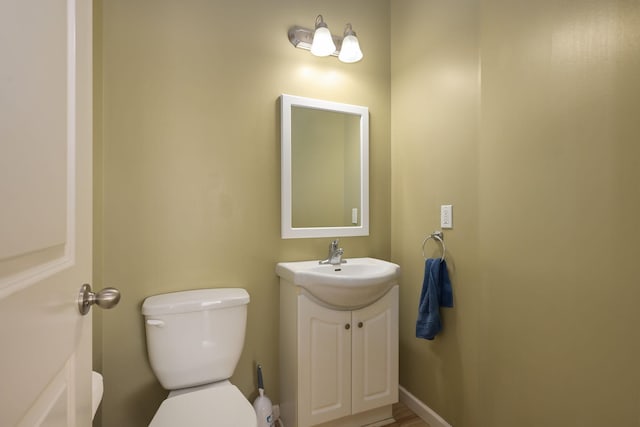 bathroom with toilet and vanity