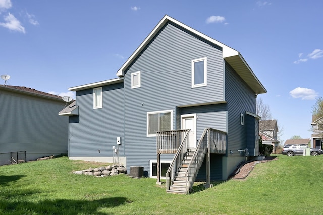 rear view of property featuring stairs, a yard, a wooden deck, and cooling unit