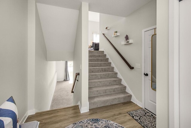 18122 Garland Path, Lakeville, MN 55044 - stairs featuring wood finished floors and baseboards