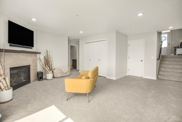 18122 Garland Path, Lakeville, MN 55044 - carpeted living room with a tile fireplace, recessed lighting, stairway, and baseboards