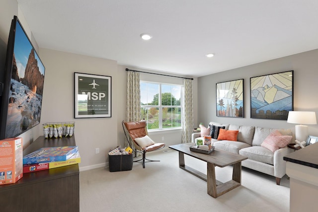 living area with light colored carpet, recessed lighting, and baseboards