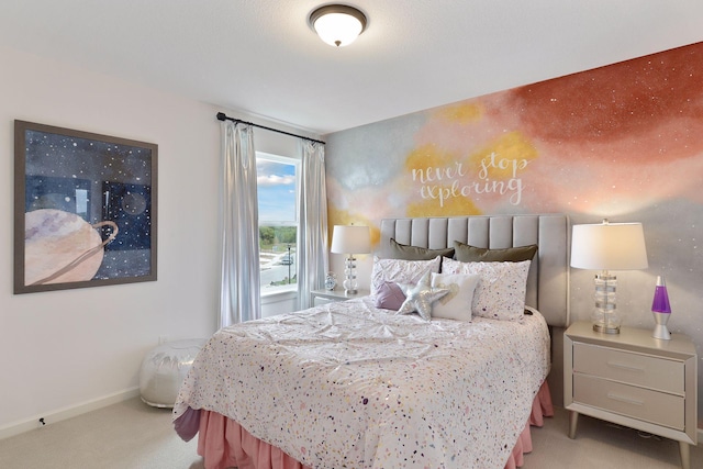bedroom featuring carpet flooring and baseboards