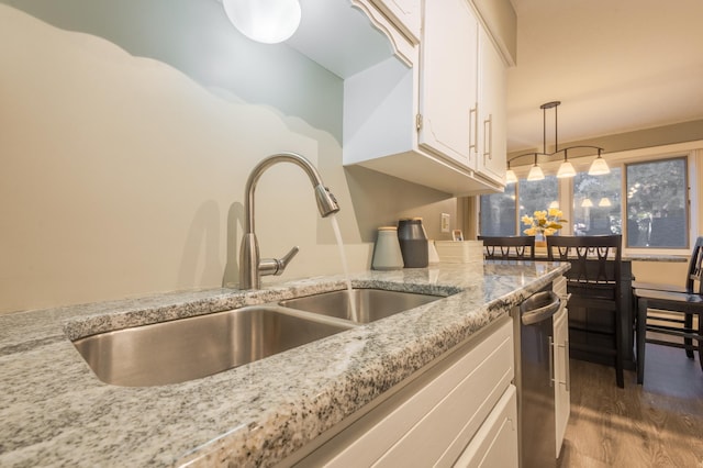 2520 Le Homme Dieu Hts NE Unit 2, Alexandria Twp, MN 56308 - kitchen with a sink, white cabinets, dark wood-style flooring, and pendant lighting