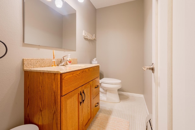 2520 Le Homme Dieu Hts NE Unit 2, Alexandria Twp, MN 56308 - bathroom with toilet, vanity, and tile patterned flooring