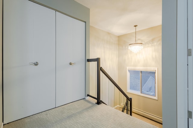 2520 Le Homme Dieu Hts NE Unit 2, Alexandria Twp, MN 56308 - corridor featuring an upstairs landing, carpet flooring, a chandelier, and a baseboard heating unit