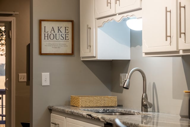 2520 Le Homme Dieu Hts NE Unit 2, Alexandria Twp, MN 56308 - kitchen with a sink and white cabinetry
