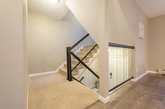 2520 Le Homme Dieu Hts NE Unit 2, Alexandria Twp, MN 56308 - staircase with baseboards and wood finished floors
