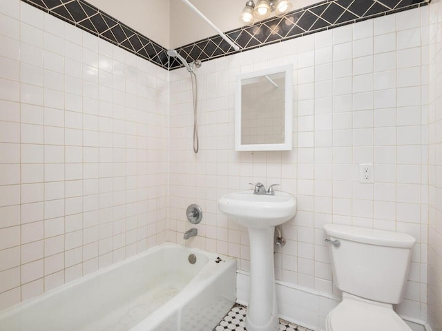 2100 Dupont Ave N, Minneapolis, MN 55411 - bathroom with tile walls, tub / shower combination, toilet, and a sink