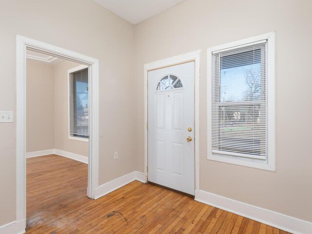 2100 Dupont Ave N, Minneapolis, MN 55411 - entryway with light wood-style flooring and baseboards