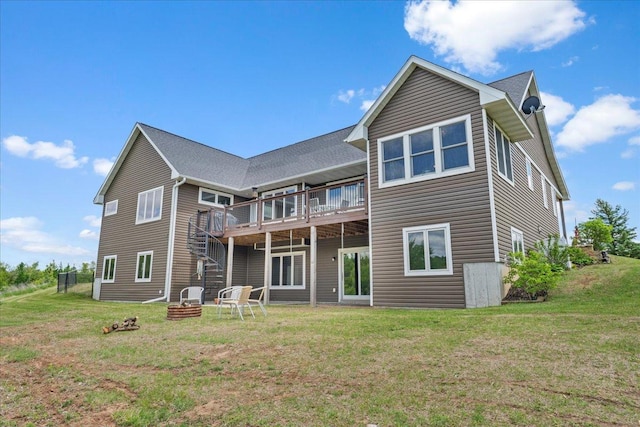 1704 156th St, Erin Prairie Twp, WI 54017 - back of house with a fire pit, a lawn, and a deck