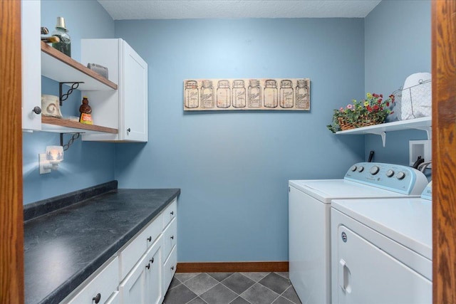 1704 156th St, Erin Prairie Twp, WI 54017 - laundry area with separate washer and dryer, cabinet space, dark tile patterned floors, and a bar