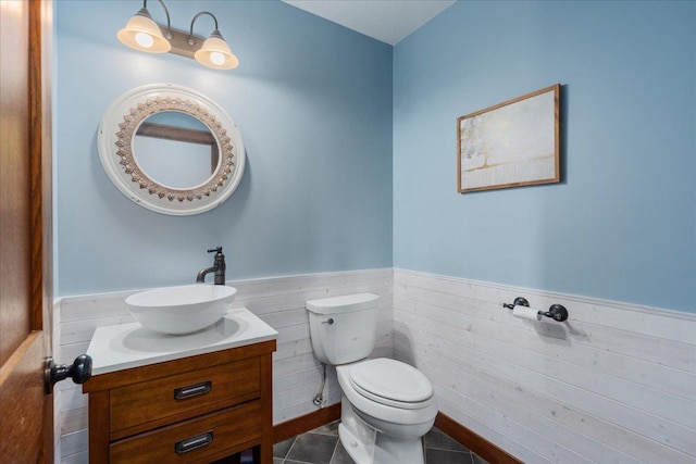 1704 156th St, Erin Prairie Twp, WI 54017 - bathroom featuring wainscoting, vanity, and tile patterned floors