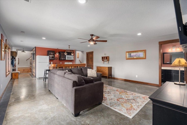 1704 156th St, Erin Prairie Twp, WI 54017 - living room with finished concrete flooring, a ceiling fan, recessed lighting, a textured ceiling, and bar