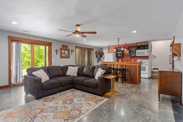 1704 156th St, Erin Prairie Twp, WI 54017 - living area featuring concrete flooring, a ceiling fan, recessed lighting, and a textured ceiling