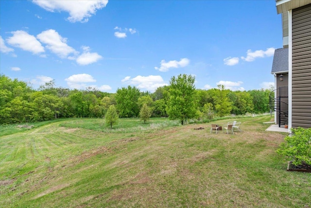 1704 156th St, Erin Prairie Twp, WI 54017 - view of grassy yard with a forest view and stairway