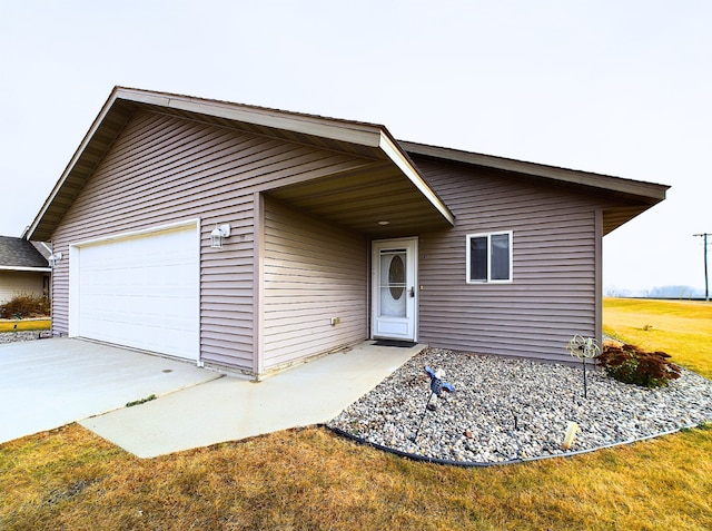 114 8th St S, Hoffman, MN 56339 - view of front of home featuring driveway and an attached garage