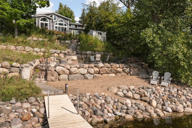 view of yard featuring a boat dock