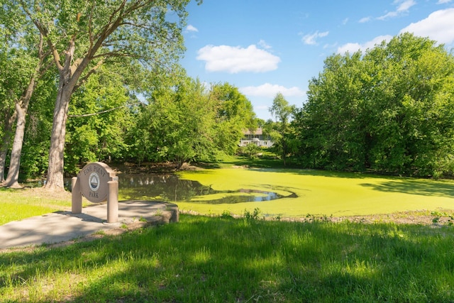 surrounding community featuring a water view