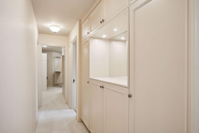 hallway with light carpet
