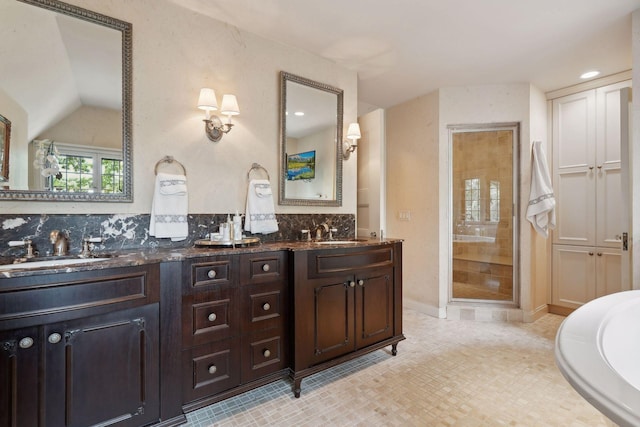 full bathroom featuring a stall shower, tasteful backsplash, double vanity, vaulted ceiling, and recessed lighting