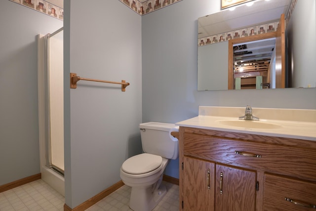 full bathroom featuring a shower stall, toilet, vanity, and baseboards