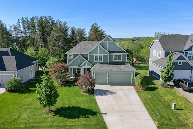 1088 Pine Hill Ln, White Bear Lake, MN 55127 - craftsman house with board and batten siding, concrete driveway, an attached garage, and a front yard