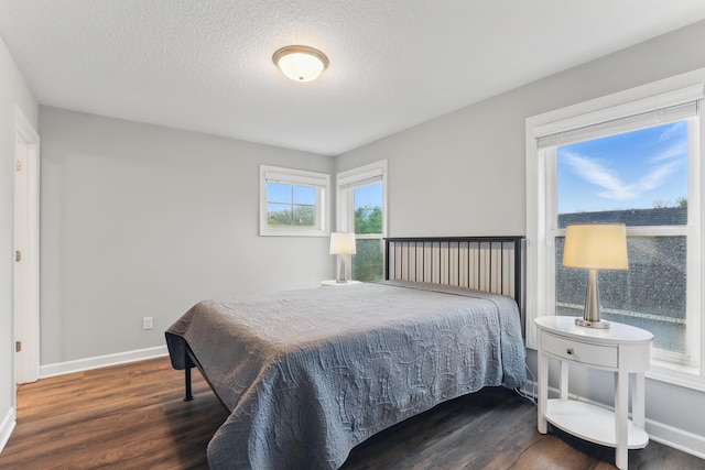 1088 Pine Hill Ln, White Bear Lake, MN 55127 - bedroom featuring wood finished floors, baseboards, and a textured ceiling