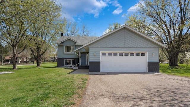 2070 Prospect Dr NE, Saint Cloud, MN 56304 - view of front of house with brick siding, a front yard, a garage, and asphalt driveway