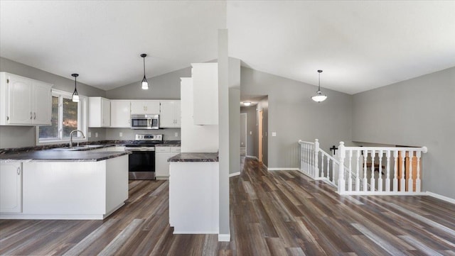 2070 Prospect Dr NE, Saint Cloud, MN 56304 - kitchen with appliances with stainless steel finishes, lofted ceiling, dark countertops, a sink, and dark wood-style floors