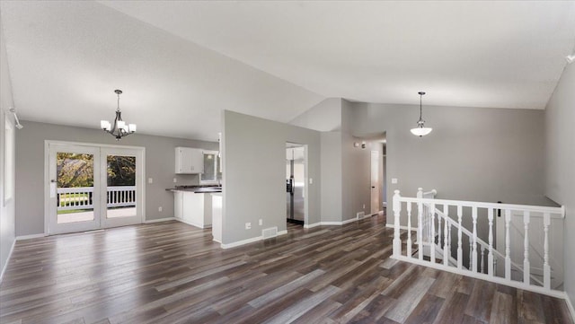 2070 Prospect Dr NE, Saint Cloud, MN 56304 - unfurnished living room with lofted ceiling, dark wood finished floors, a chandelier, and baseboards