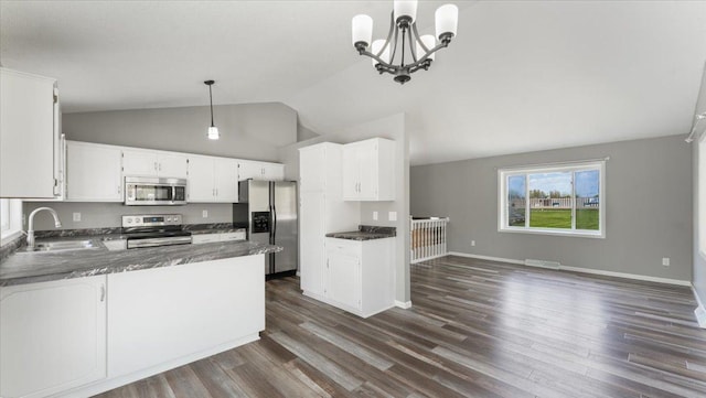 2070 Prospect Dr NE, Saint Cloud, MN 56304 - kitchen featuring appliances with stainless steel finishes, a sink, dark wood finished floors, open floor plan, and dark countertops