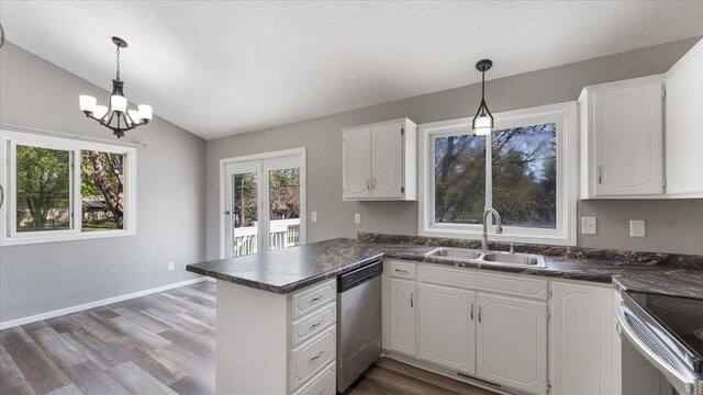 2070 Prospect Dr NE, Saint Cloud, MN 56304 - kitchen with a sink, stainless steel appliances, dark countertops, lofted ceiling, and a peninsula