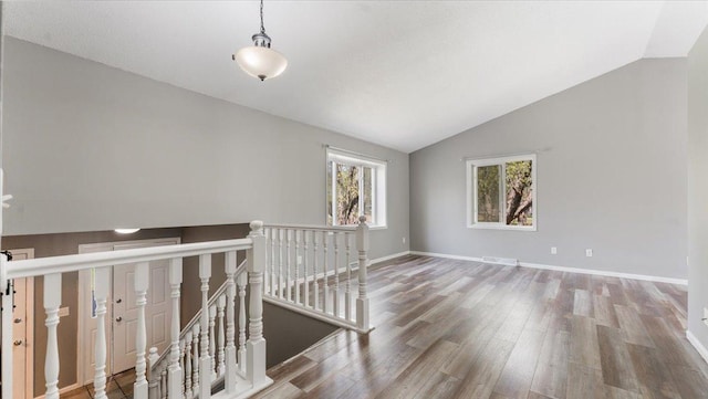 2070 Prospect Dr NE, Saint Cloud, MN 56304 - unfurnished room with lofted ceiling, wood finished floors, and baseboards
