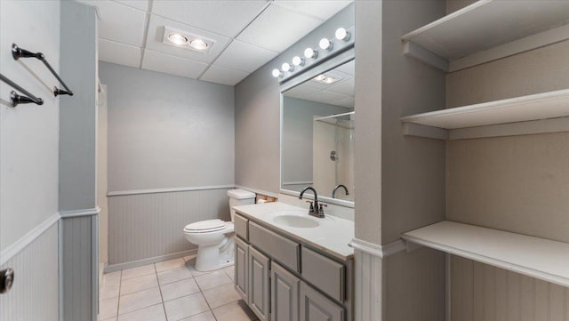 2070 Prospect Dr NE, Saint Cloud, MN 56304 - full bathroom featuring a wainscoted wall, a shower, toilet, tile patterned floors, and vanity