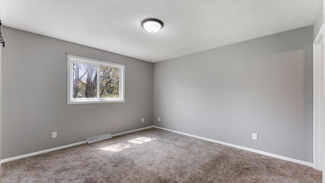 2070 Prospect Dr NE, Saint Cloud, MN 56304 - unfurnished room with carpet floors, baseboards, and a textured ceiling
