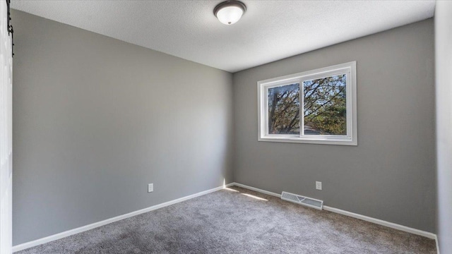 2070 Prospect Dr NE, Saint Cloud, MN 56304 - carpeted spare room with baseboards and a textured ceiling