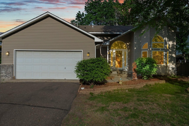 13367 Martin St NW, Andover, MN 55304 - traditional home with asphalt driveway, a garage, and a front yard