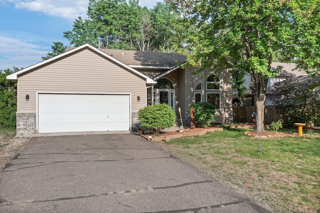 13367 Martin St NW, Andover, MN 55304 - view of front of house with brick siding, driveway, and a garage