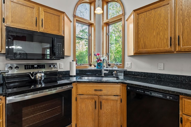 13367 Martin St NW, Andover, MN 55304 - kitchen featuring black appliances, a sink, healthy amount of natural light, and brown cabinets