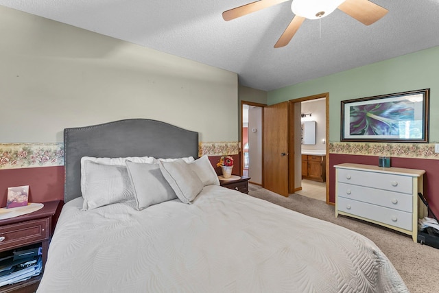 13367 Martin St NW, Andover, MN 55304 - bedroom with light carpet, a textured ceiling, ensuite bathroom, and a ceiling fan
