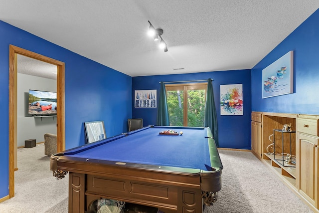 13367 Martin St NW, Andover, MN 55304 - playroom with carpet floors, a textured ceiling, billiards, track lighting, and baseboards
