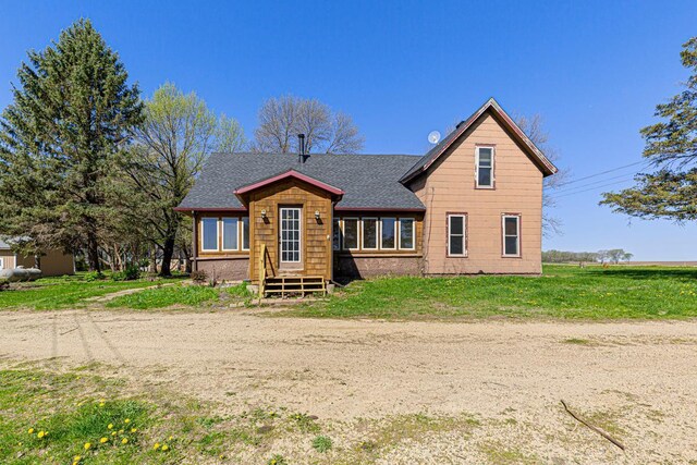 3020 320th St E, Sciota Twp, MN 55057 - view of front of home with a shingled roof and a front lawn