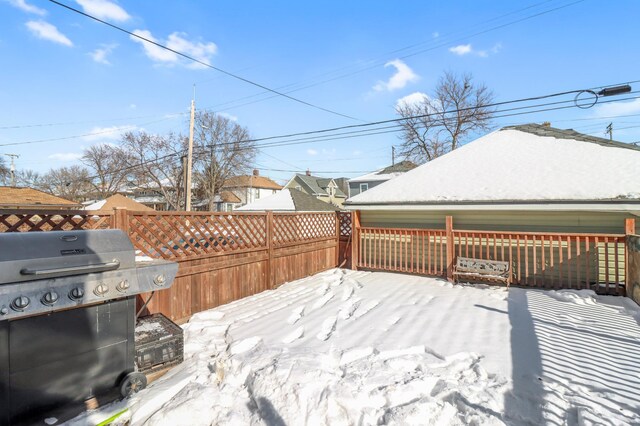 wooden deck with fence and a grill