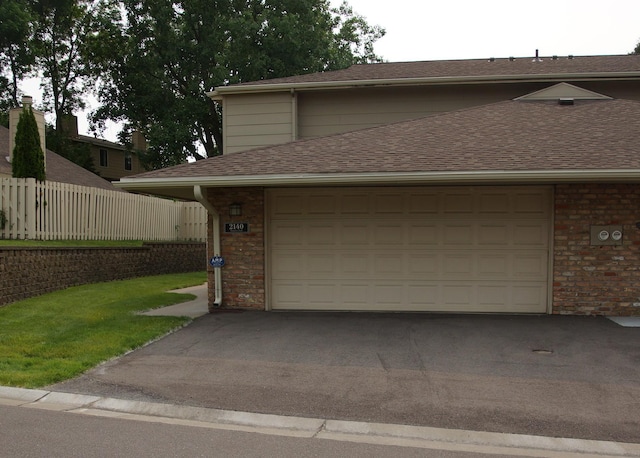 2140 Tamarin Trl, Golden Valley, MN 55427 - garage featuring driveway