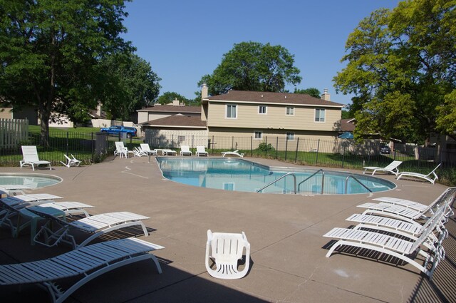 2140 Tamarin Trl, Golden Valley, MN 55427 - community pool featuring a patio area