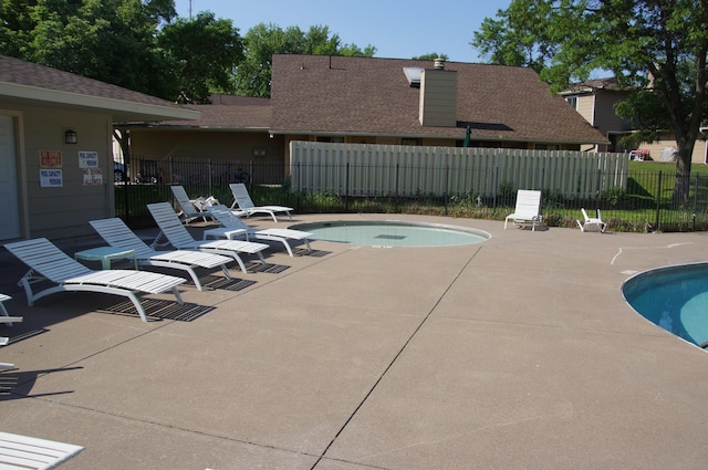 2140 Tamarin Trl, Golden Valley, MN 55427 - community pool featuring a patio area