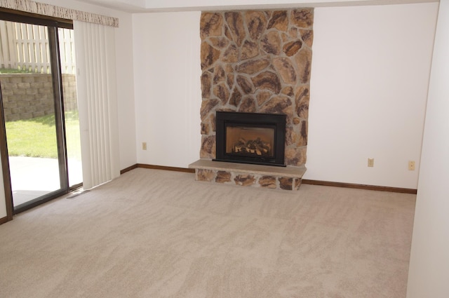 2140 Tamarin Trl, Golden Valley, MN 55427 - unfurnished living room with carpet flooring, a stone fireplace, and baseboards