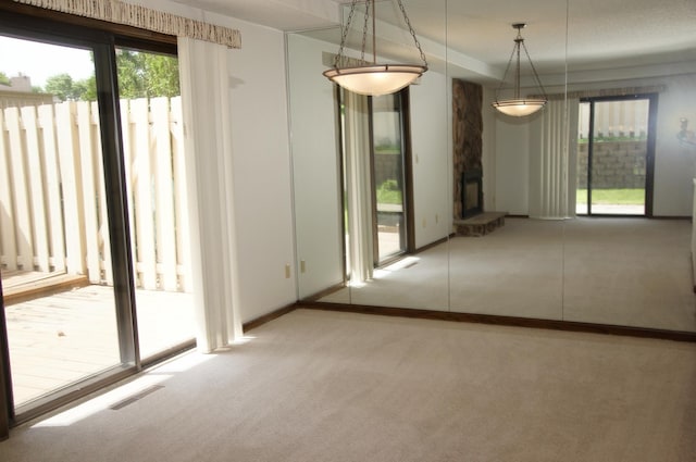 2140 Tamarin Trl, Golden Valley, MN 55427 - unfurnished dining area featuring carpet flooring and baseboards