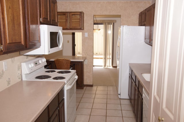 2140 Tamarin Trl, Golden Valley, MN 55427 - kitchen featuring white appliances, light countertops, and light tile patterned floors